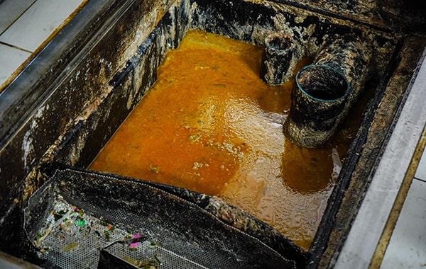 regular grease trap cleaning can prevent costly plumbing problems and reduce the risk of fines, saving you money in the long run